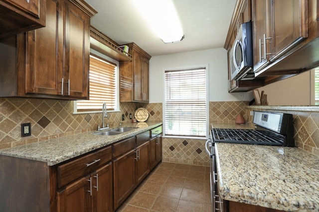 3000 Stevens Dr, Bryan, TX 77803 - kitchen with stainless steel appliances, a sink, and healthy amount of natural light