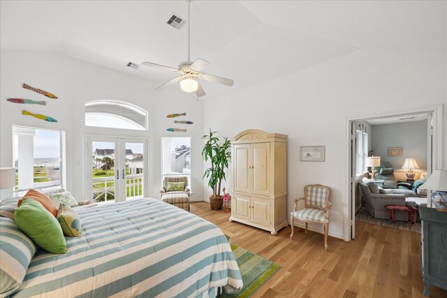 4100 Sand Crab Ln, Galveston, TX 77554 - bedroom featuring high vaulted ceiling, light wood-style floors, french doors, access to outside, and ceiling fan