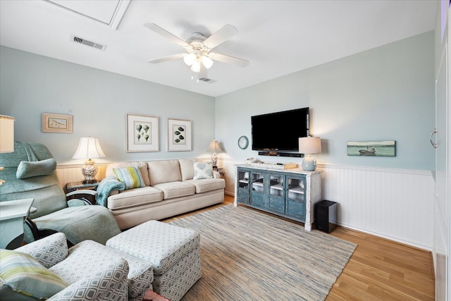 4100 Sand Crab Ln, Galveston, TX 77554 - living room with wood finished floors, ceiling fan, and wainscoting