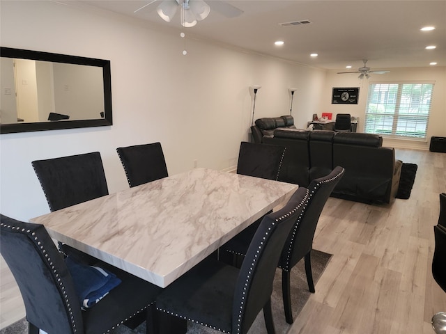 12907 Trail Hollow Dr Unit 2907, Houston, TX 77079 - dining space featuring a ceiling fan, light wood-type flooring, recessed lighting, and crown molding
