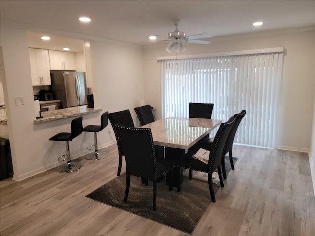 12907 Trail Hollow Dr Unit 2907, Houston, TX 77079 - dining room featuring light wood-type flooring, a ceiling fan, baseboards, recessed lighting, and crown molding