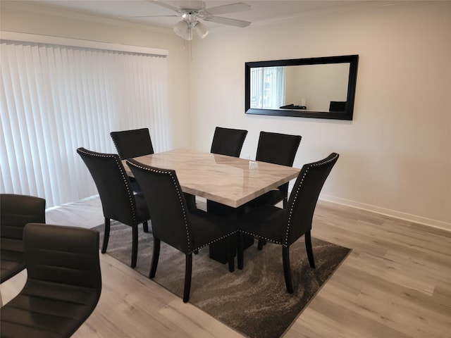 12907 Trail Hollow Dr Unit 2907, Houston, TX 77079 - dining room featuring light wood-type flooring, crown molding, baseboards, and a ceiling fan