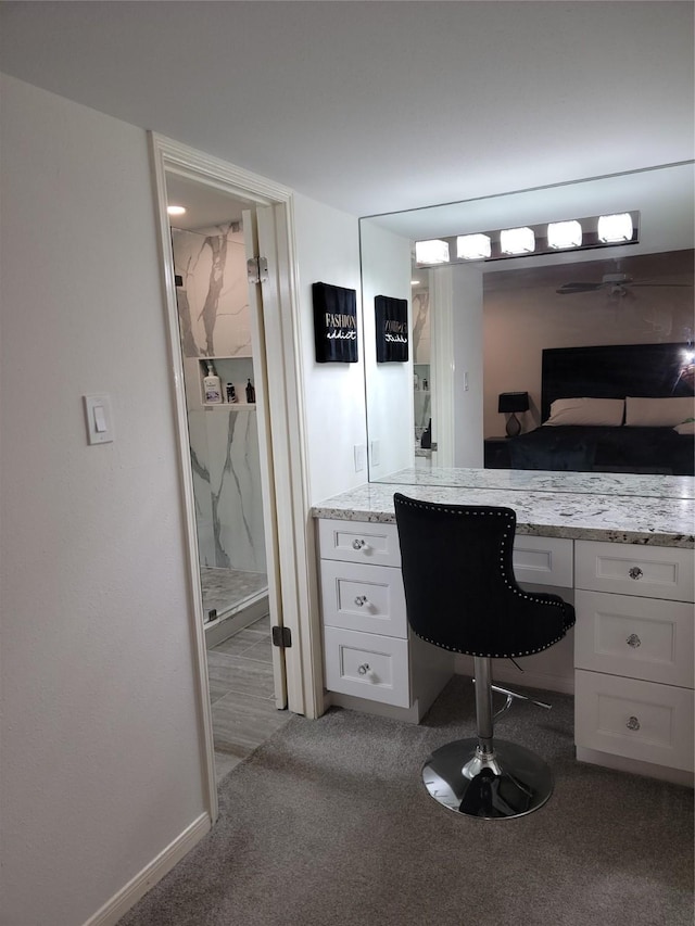 12907 Trail Hollow Dr Unit 2907, Houston, TX 77079 - ensuite bathroom featuring a marble finish shower, baseboards, and vanity