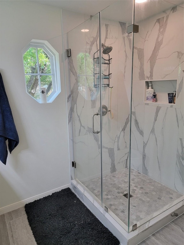12907 Trail Hollow Dr Unit 2907, Houston, TX 77079 - bathroom featuring a marble finish shower and baseboards