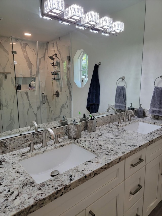 12907 Trail Hollow Dr Unit 2907, Houston, TX 77079 - bathroom with double vanity, a marble finish shower, and a chandelier