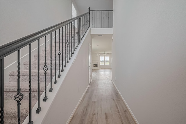 15502 Islandview Ln, Houston, TX 77053 - stairway featuring wood finished floors, baseboards, and a high ceiling