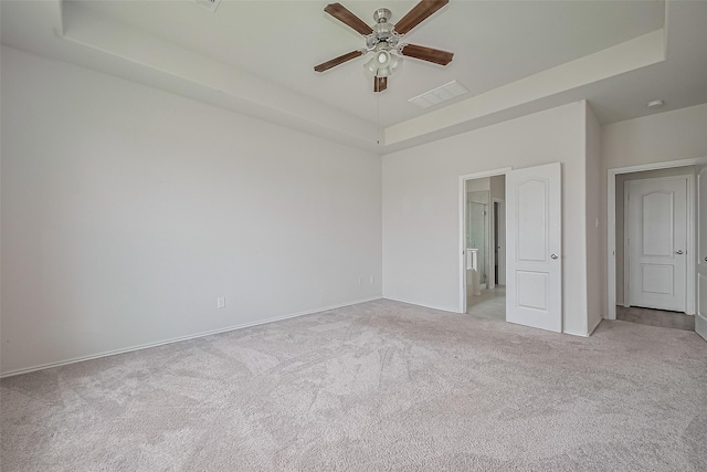 15502 Islandview Ln, Houston, TX 77053 - unfurnished bedroom with a raised ceiling, light colored carpet, baseboards, and a ceiling fan