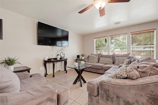 14251 Winecup Ln, Houston, TX 77047 - living area with a textured ceiling, light tile patterned flooring, and a ceiling fan
