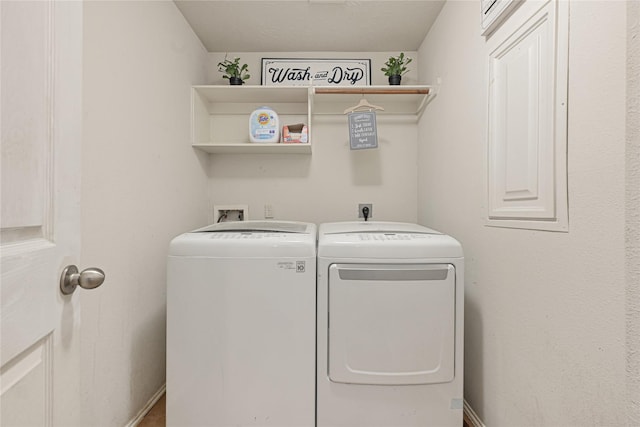 14251 Winecup Ln, Houston, TX 77047 - laundry area with washing machine and dryer and baseboards