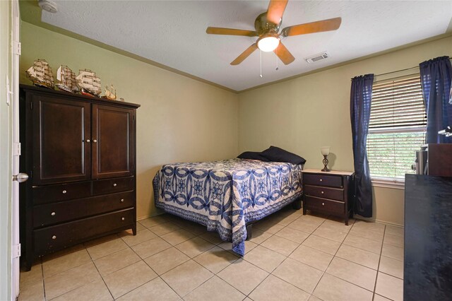 14251 Winecup Ln, Houston, TX 77047 - bedroom featuring light tile patterned floors, ceiling fan, and baseboards