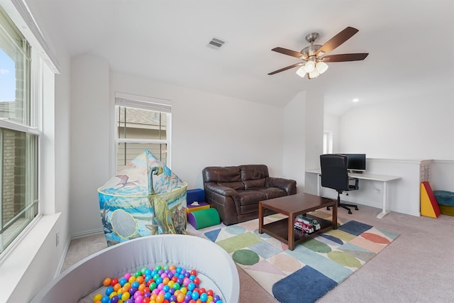 12526 Sabine Point Dr, Humble, TX 77346 - carpeted living area featuring a ceiling fan, an office area, vaulted ceiling, and baseboards