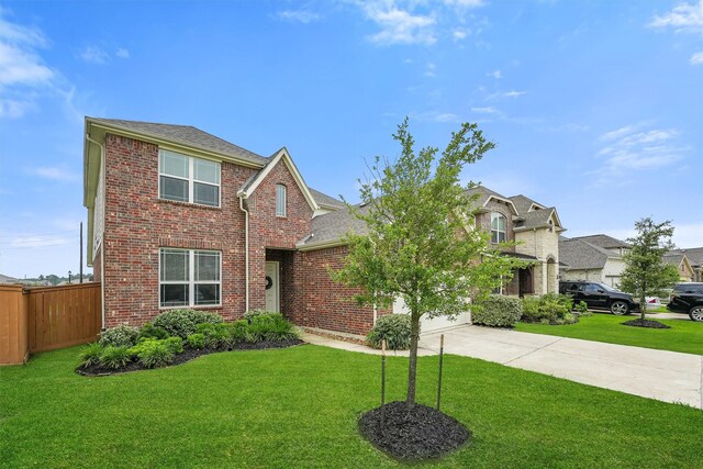 12526 Sabine Point Dr, Humble, TX 77346 - traditional home with driveway, a garage, brick siding, and roof with shingles