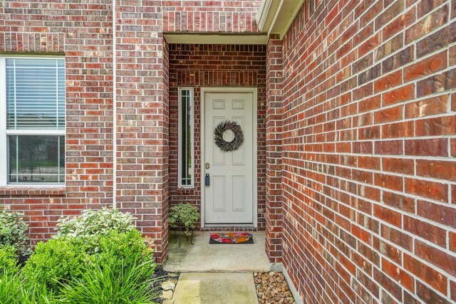 12526 Sabine Point Dr, Humble, TX 77346 - view of exterior entry with brick siding