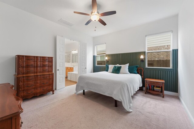 12526 Sabine Point Dr, Humble, TX 77346 - carpeted bedroom with ensuite bathroom and ceiling fan