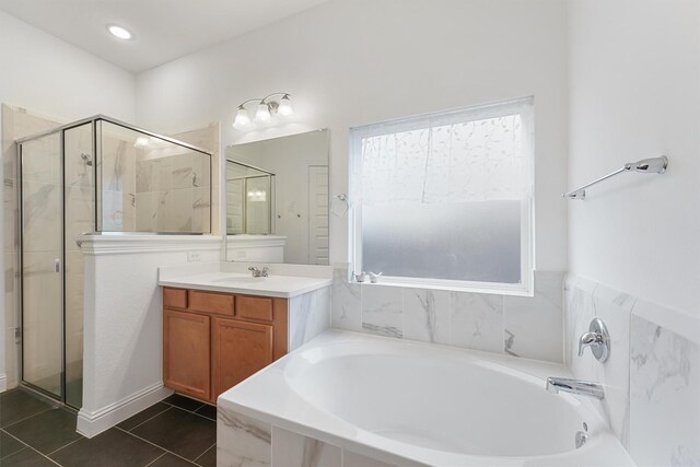 12526 Sabine Point Dr, Humble, TX 77346 - bathroom featuring a stall shower, a garden tub, vanity, and plenty of natural light