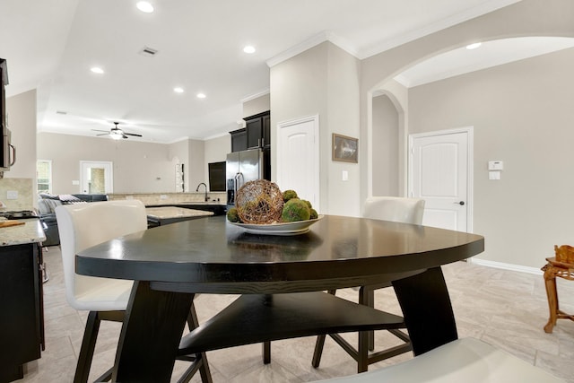 3864 Oakmist Bend Ln, Spring, TX 77386 - dining space with crown molding, recessed lighting, arched walkways, ceiling fan, and baseboards