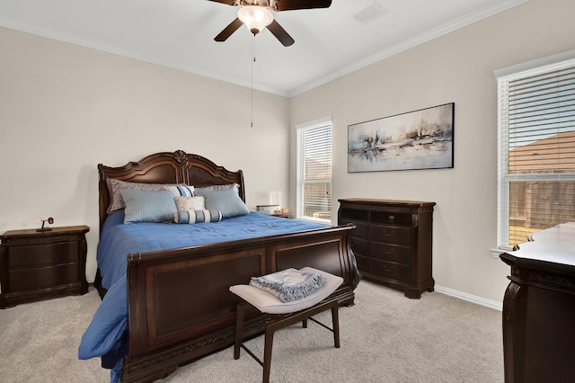 3864 Oakmist Bend Ln, Spring, TX 77386 - bedroom with light carpet, crown molding, baseboards, and a ceiling fan