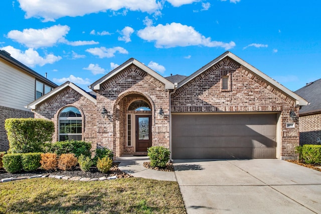 3864 Oakmist Bend Ln, Spring, TX 77386 - view of front of house with brick siding, a garage, and concrete driveway