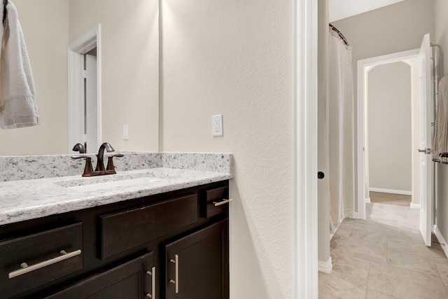 3864 Oakmist Bend Ln, Spring, TX 77386 - bathroom with vanity, baseboards, and a shower with curtain