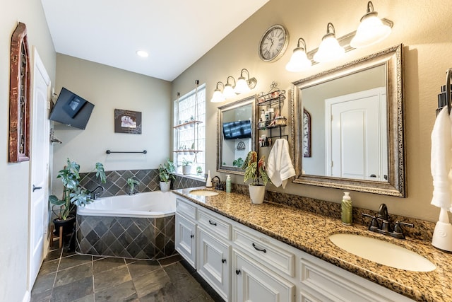 717 Overbrook, Huntsville, TX 77340 - bathroom featuring a bath and double vanity