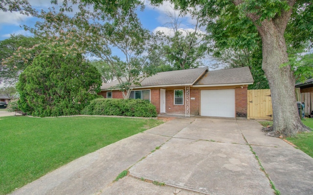 4621 W 43rd St, Houston, TX 77092 - ranch-style house featuring a garage, brick siding, driveway, a front yard, and roof with shingles