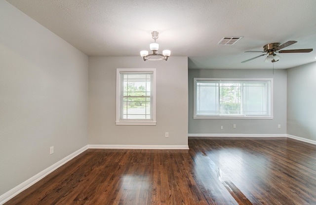 4621 W 43rd St, Houston, TX 77092 - unfurnished room featuring a chandelier, dark wood-style floors, baseboards, and a ceiling fan