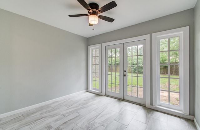 4621 W 43rd St, Houston, TX 77092 - unfurnished room featuring french doors, healthy amount of natural light, and baseboards
