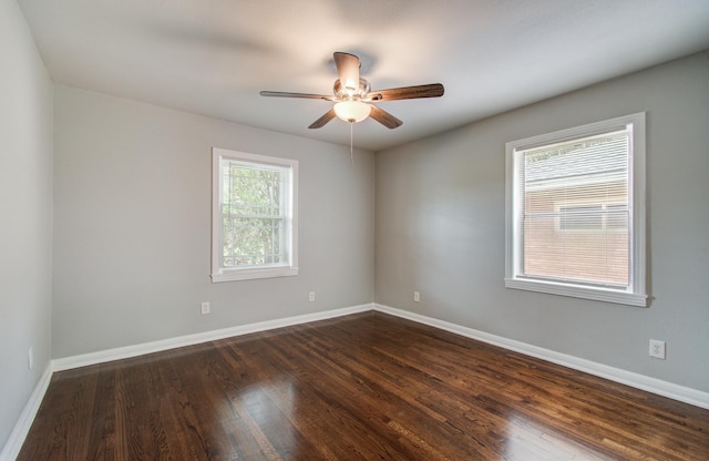 4621 W 43rd St, Houston, TX 77092 - empty room featuring a ceiling fan, dark wood-style flooring, and baseboards