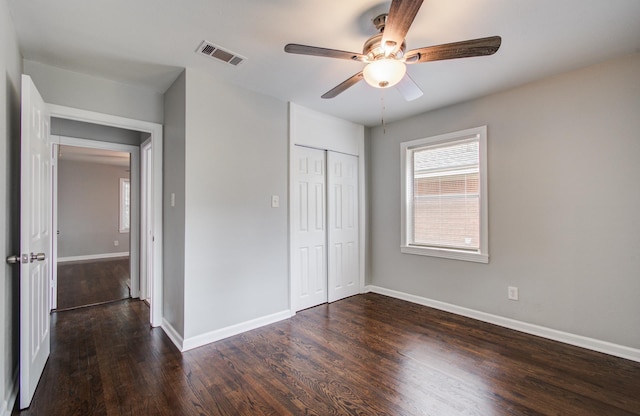 4621 W 43rd St, Houston, TX 77092 - unfurnished bedroom featuring wood finished floors, baseboards, a closet, and a ceiling fan