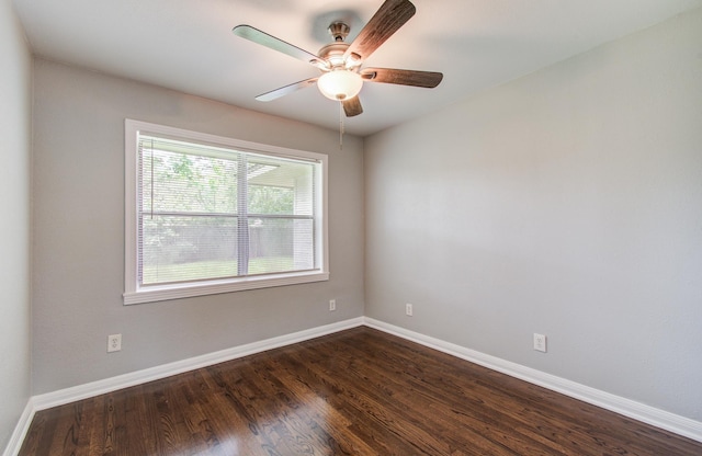 4621 W 43rd St, Houston, TX 77092 - spare room featuring baseboards, dark wood finished floors, and a ceiling fan