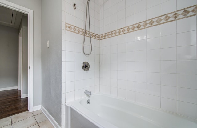 4621 W 43rd St, Houston, TX 77092 - bathroom with baseboards, tile patterned flooring, and tub / shower combination