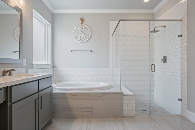 25007 Coperti Ln, Spring, TX 77386 - full bathroom with a bath, vanity, a shower stall, plenty of natural light, and ornamental molding