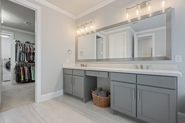 25007 Coperti Ln, Spring, TX 77386 - full bathroom featuring washer / dryer, double vanity, crown molding, a walk in closet, and baseboards