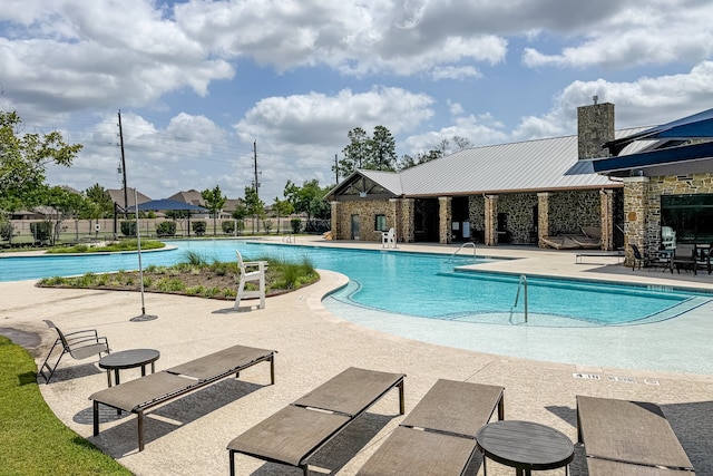 25007 Coperti Ln, Spring, TX 77386 - community pool featuring a patio area
