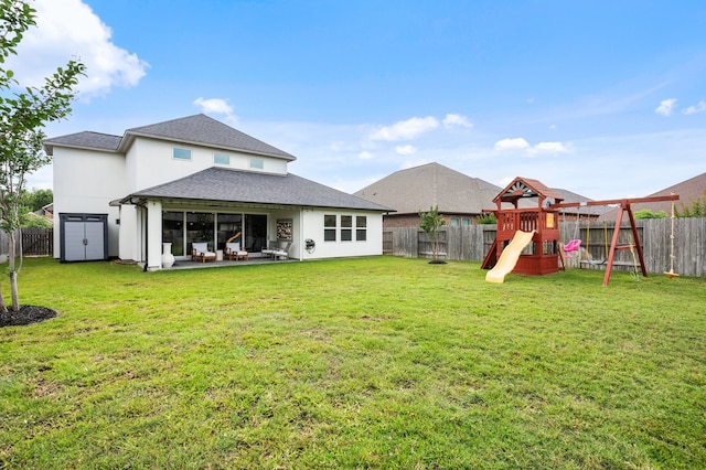 25007 Coperti Ln, Spring, TX 77386 - rear view of house with a playground, roof with shingles, a patio, and stucco siding