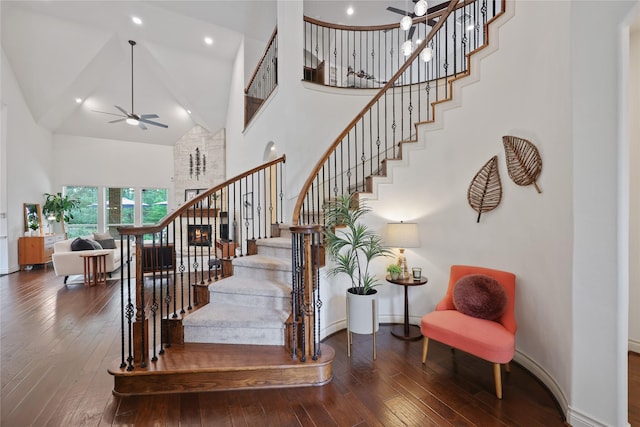 5451 Harvest Oak Landing Dr, Spring, TX 77386 - stairs featuring high vaulted ceiling, baseboards, wood-type flooring, ceiling fan, and recessed lighting