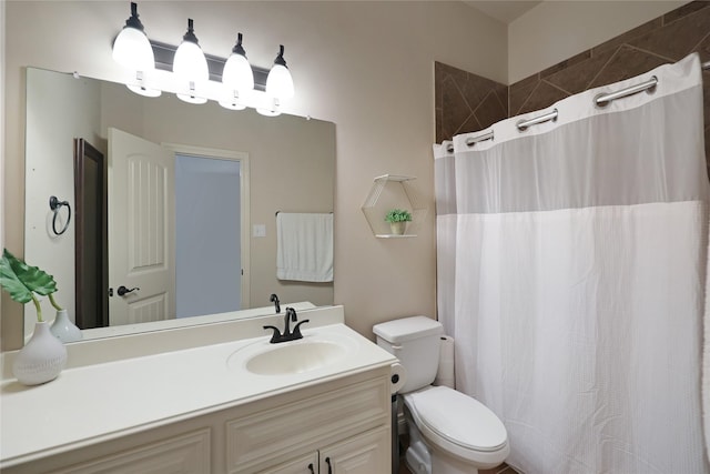 5451 Harvest Oak Landing Dr, Spring, TX 77386 - full bath featuring toilet, vanity, and a shower with curtain