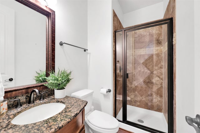 5451 Harvest Oak Landing Dr, Spring, TX 77386 - bathroom featuring a stall shower, toilet, and vanity