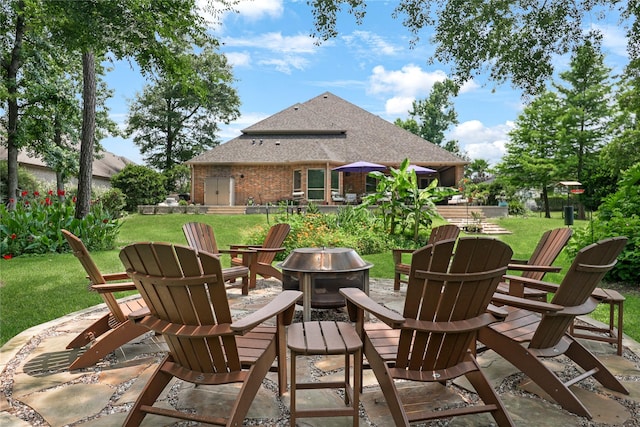 5451 Harvest Oak Landing Dr, Spring, TX 77386 - view of patio / terrace with an outdoor fire pit