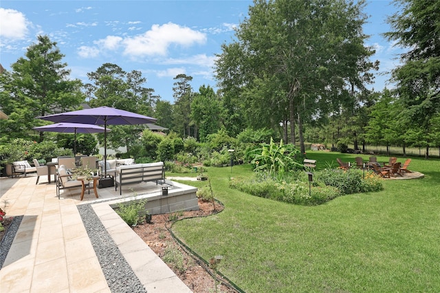 5451 Harvest Oak Landing Dr, Spring, TX 77386 - view of home's community featuring an outdoor living space with a fire pit, a patio area, and a lawn