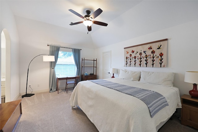 5451 Harvest Oak Landing Dr, Spring, TX 77386 - bedroom with carpet floors, baseboards, lofted ceiling, a ceiling fan, and arched walkways