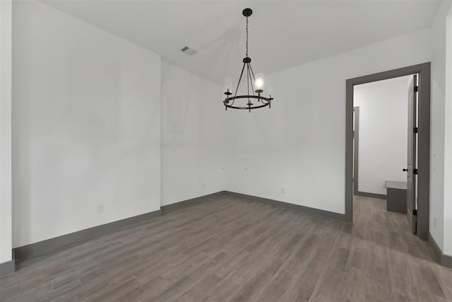 1806 Athens Dr, Roman Forest, TX 77357 - unfurnished dining area featuring wood finished floors, a chandelier, and baseboards
