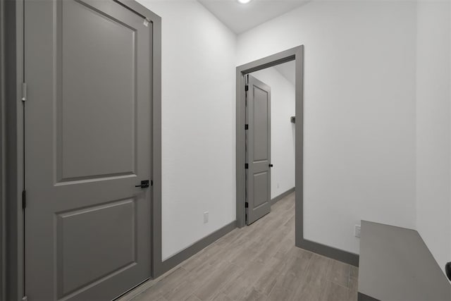 1806 Athens Dr, Roman Forest, TX 77357 - corridor with light wood-style floors and baseboards