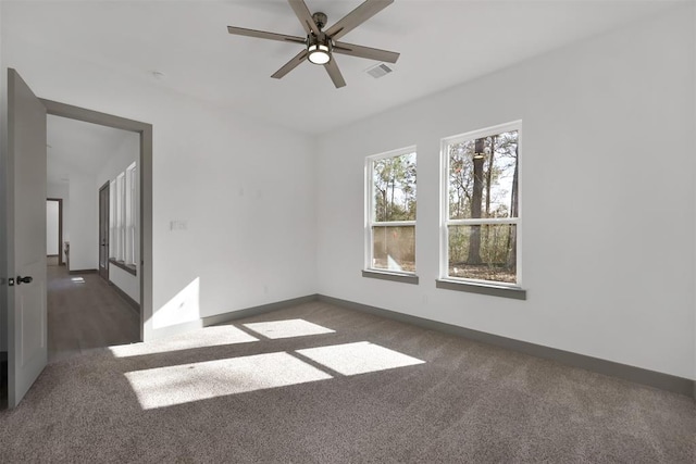 1806 Athens Dr, Roman Forest, TX 77357 - empty room with carpet flooring, a ceiling fan, and baseboards