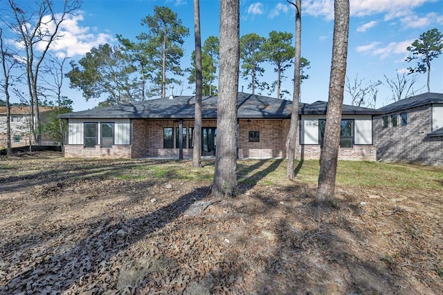 1806 Athens Dr, Roman Forest, TX 77357 - rear view of property featuring brick siding