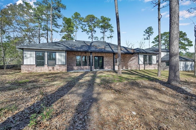 1806 Athens Dr, Roman Forest, TX 77357 - rear view of property with brick siding