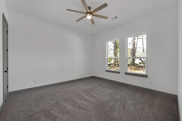 1806 Athens Dr, Roman Forest, TX 77357 - empty room featuring dark carpet, a ceiling fan, and baseboards