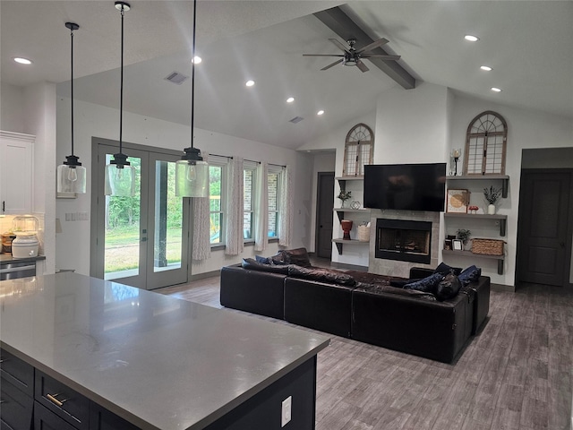 1806 Athens Dr, Roman Forest, TX 77357 - living room featuring beam ceiling, french doors, light wood-type flooring, high vaulted ceiling, and recessed lighting