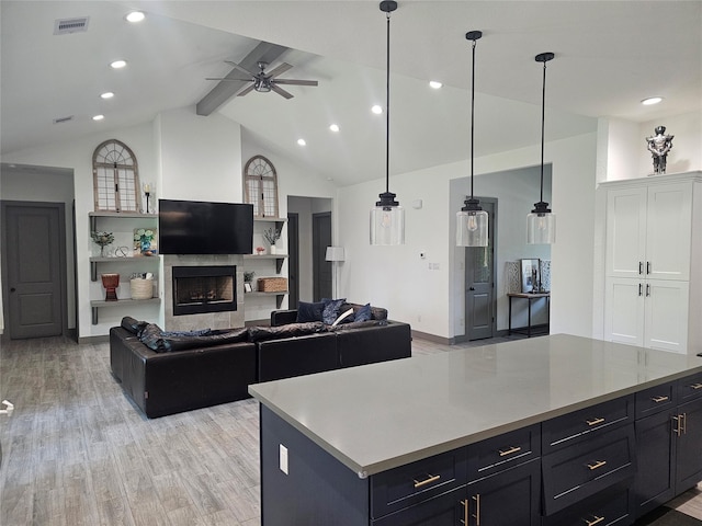 1806 Athens Dr, Roman Forest, TX 77357 - living area featuring light wood finished floors, a ceiling fan, recessed lighting, a fireplace, and baseboards