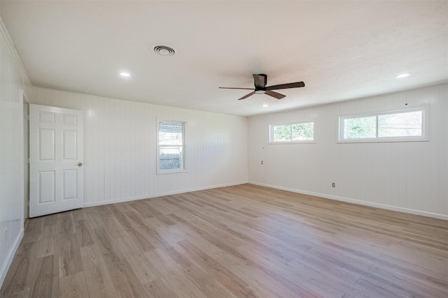 9419 Campbell Rd, Houston, TX 77080 - spare room featuring light wood-type flooring, a ceiling fan, and baseboards
